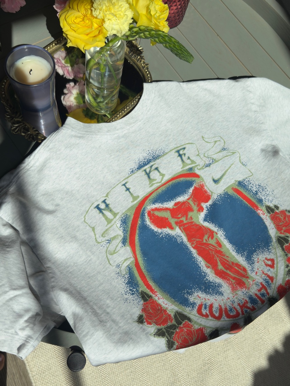 Nike Vintage-style Graphic Tee with Winged Female Figure